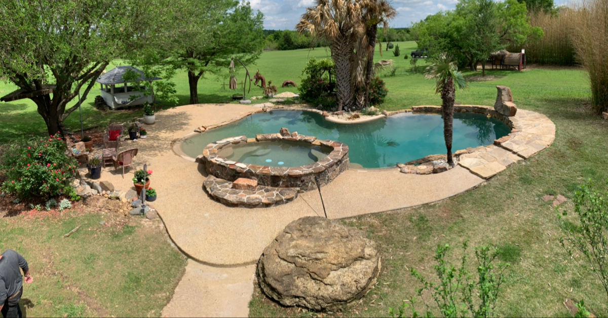 Custom pool deck with spa and decorative concrete